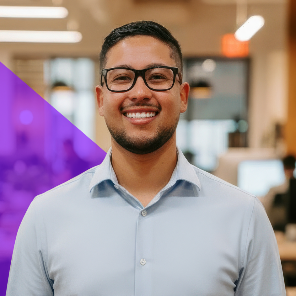 Enrique Corado, VP of Research & Development at Total Service, smiling in a professional setting, showcasing leadership in technology solutions for the elevator service industry.